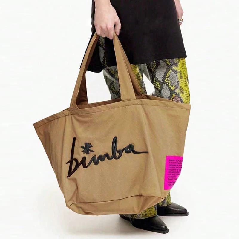 Bolso de mano popular de color sólido, moderno y sencillo, de gran capacidad, con letras bordadas informales personalizadas y multifuncionales