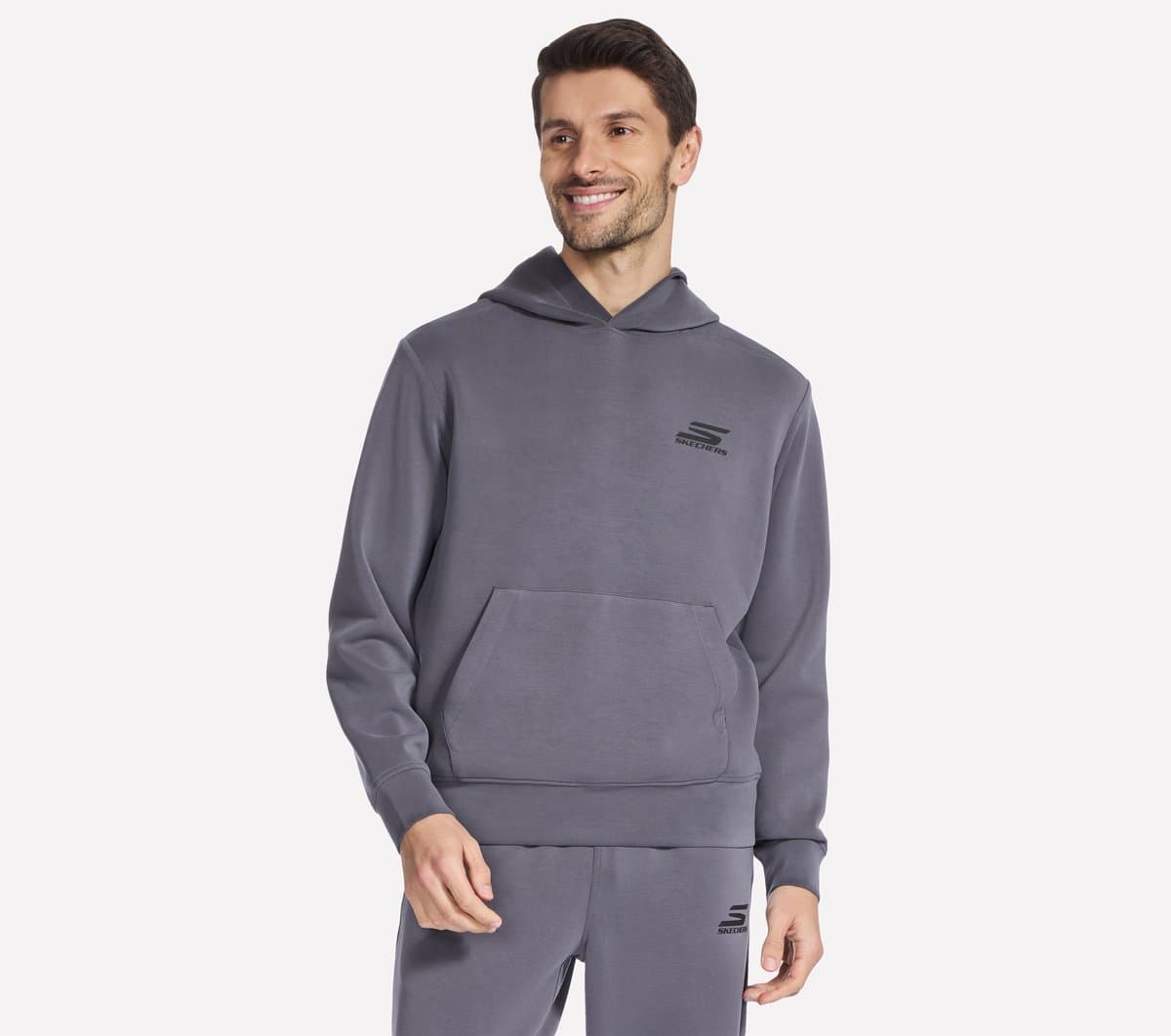 Skechers SKECHCLOUD Elevate sudadera en Negro/Marengo, talla Pequeña
